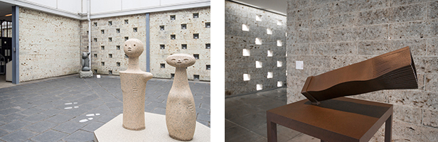 左：中庭中央に置かれたイサム・ノグチの「こけし」。右：1階の壁は栃木産の大谷石が積まれている。